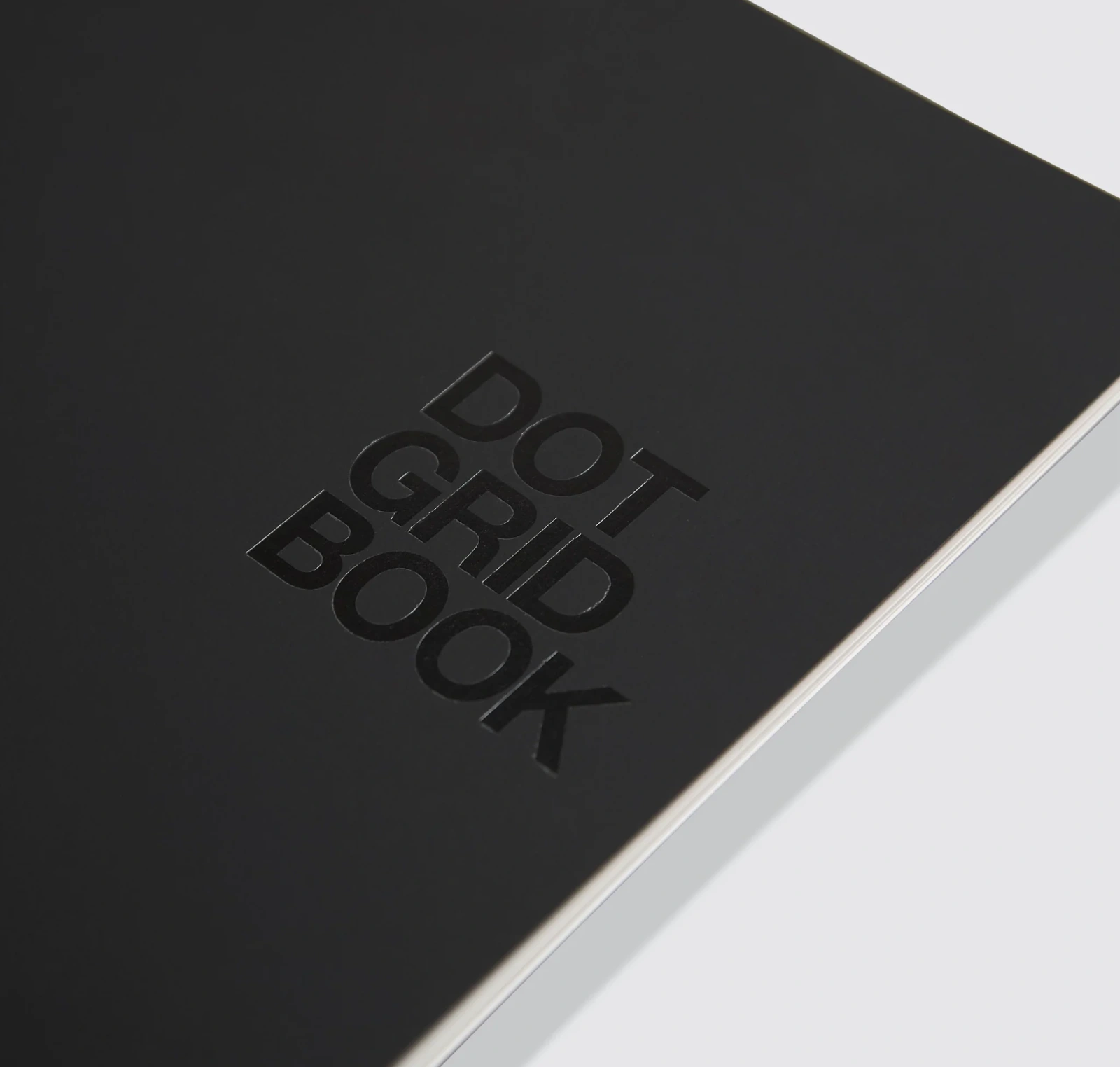 Black Action Method Dot Grid Book with embossed cover lettering